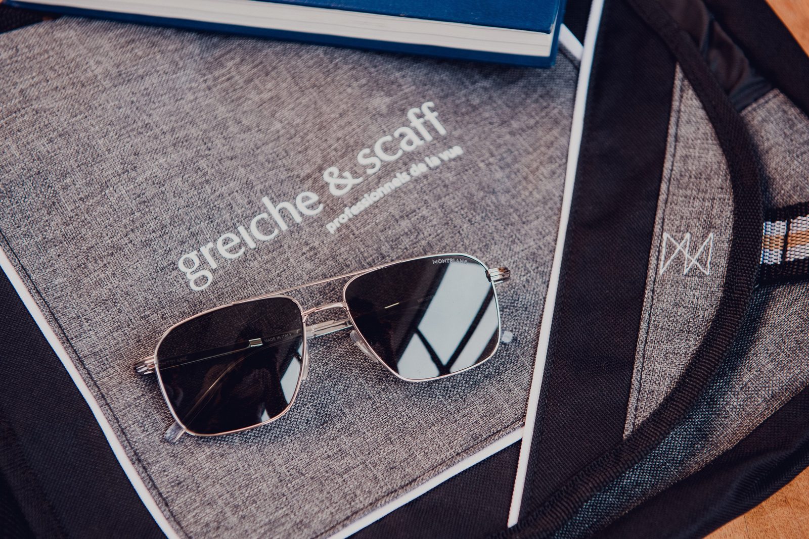 Sunglasses resting on a Greiche & Scaff magazine